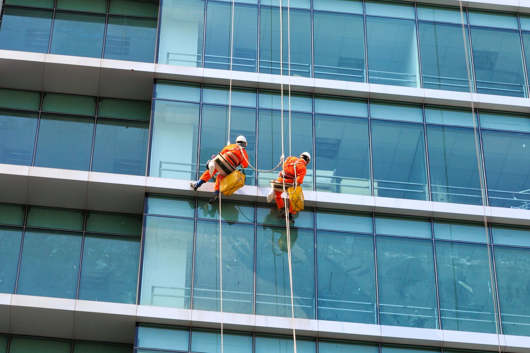 Window cleaners on high-rise building